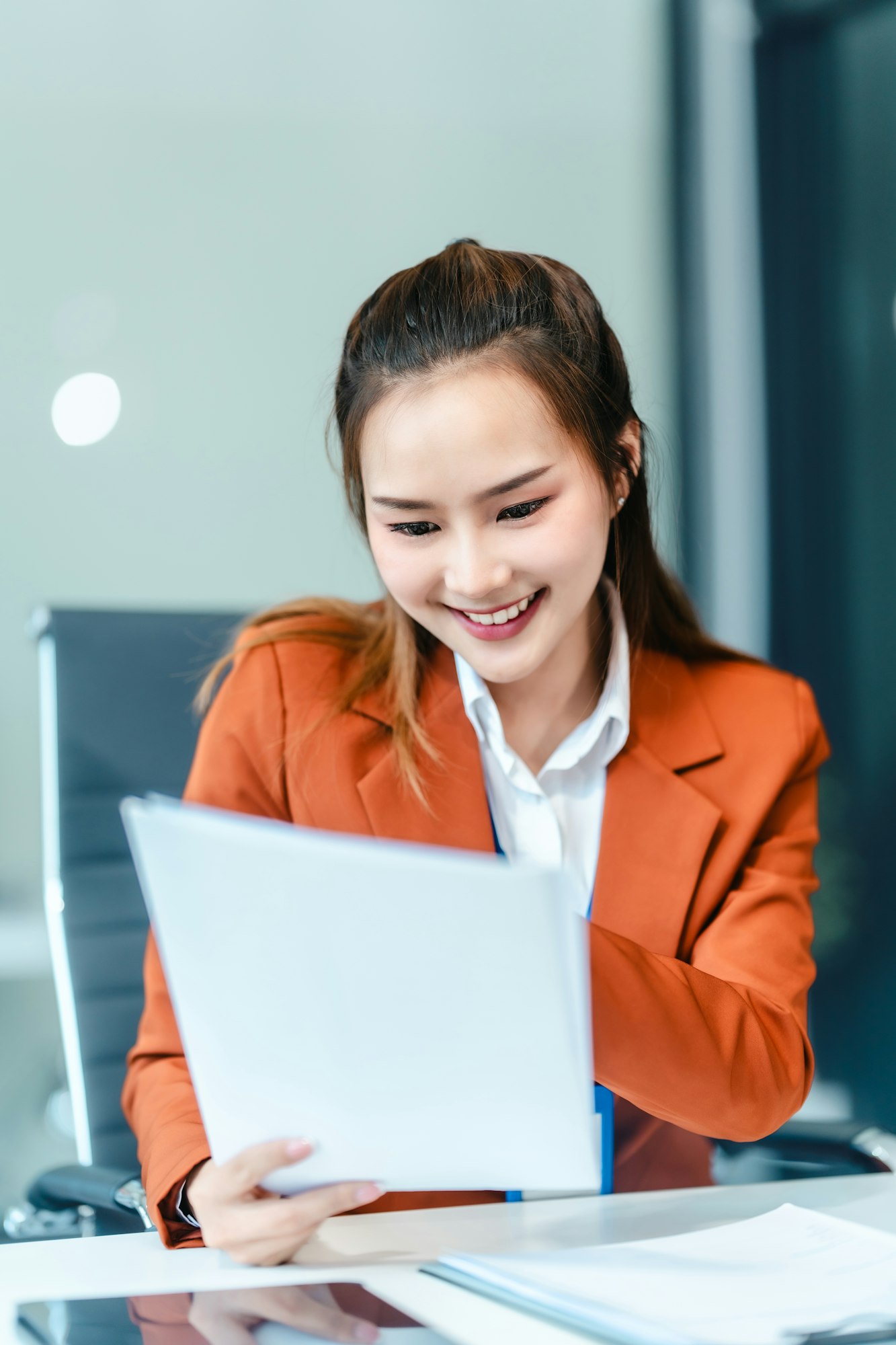 In Asian legal compliance, faculty of law, legal counseling office female lawyer reads a contract