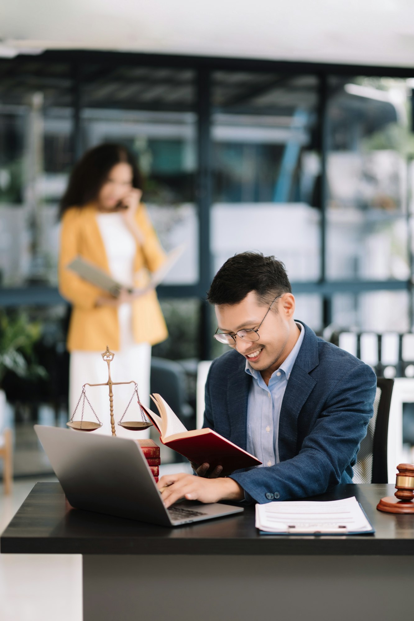 Man lawyer working and gavel, tablet, laptop in front, Advice justice and law concept.